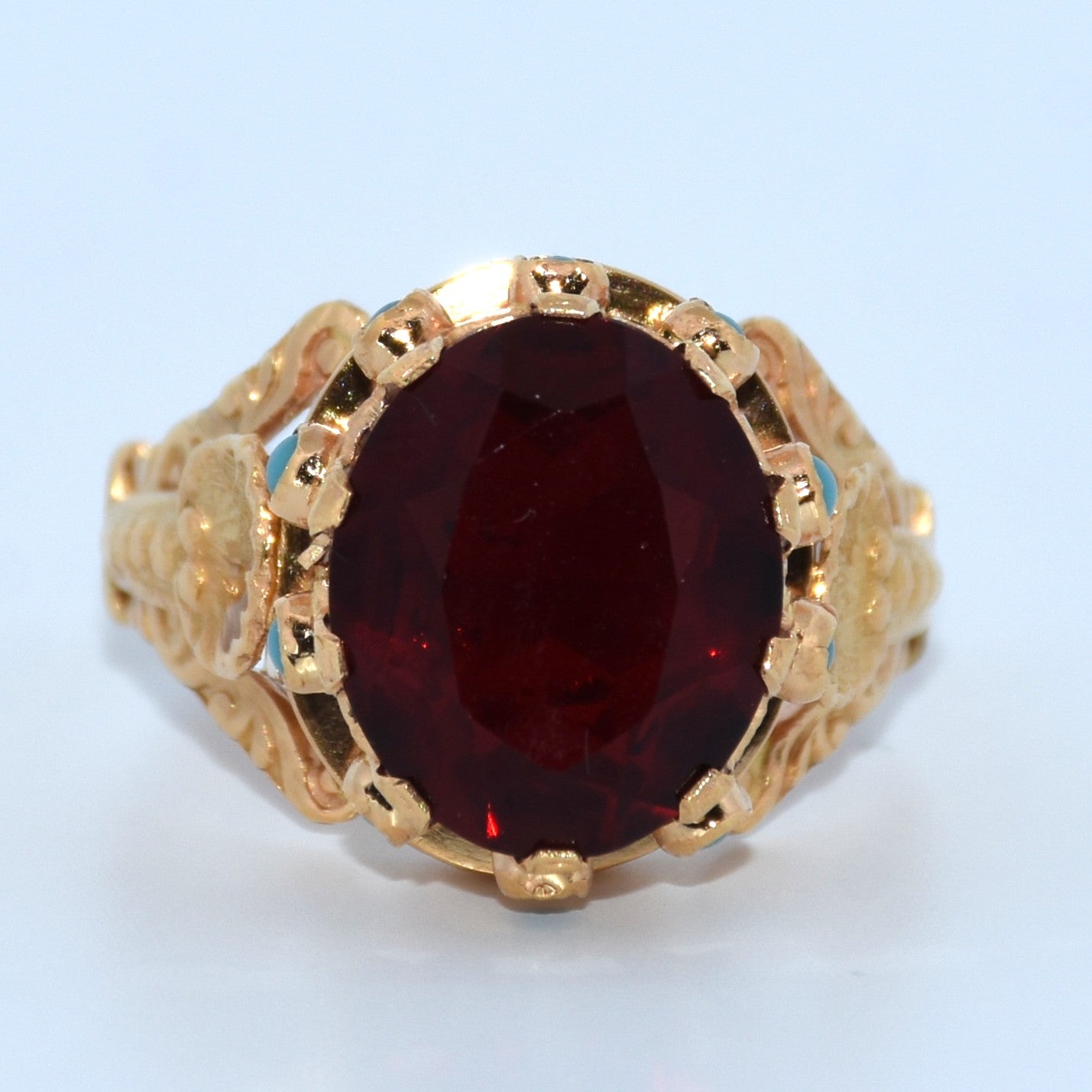 19.2K Portuguese Gold | Oval Garnet Ring