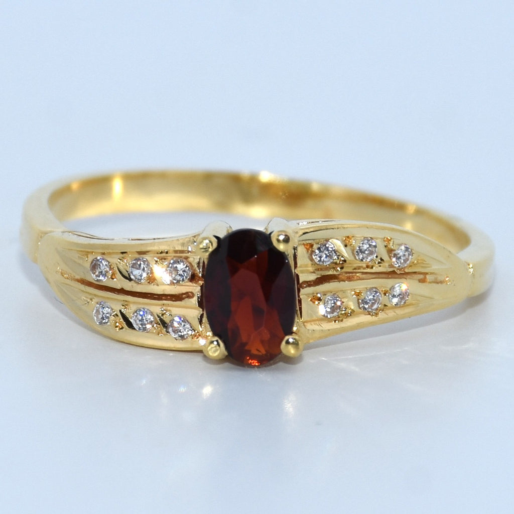 19.2K Portuguese Gold | Oval Garnet Ring